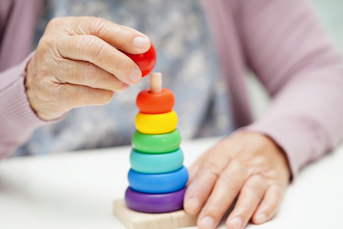 bigstock-Asian-Elderly-Woman-Playing-Pu-478518725