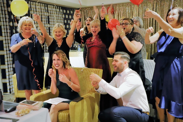 Marika holds Kevin Hickman award she won